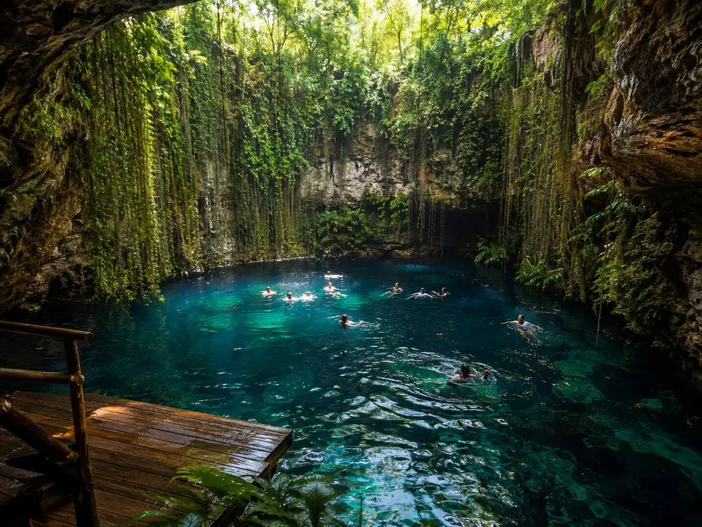 Swimmers in a fresh-water cenote near Playa del Carmen